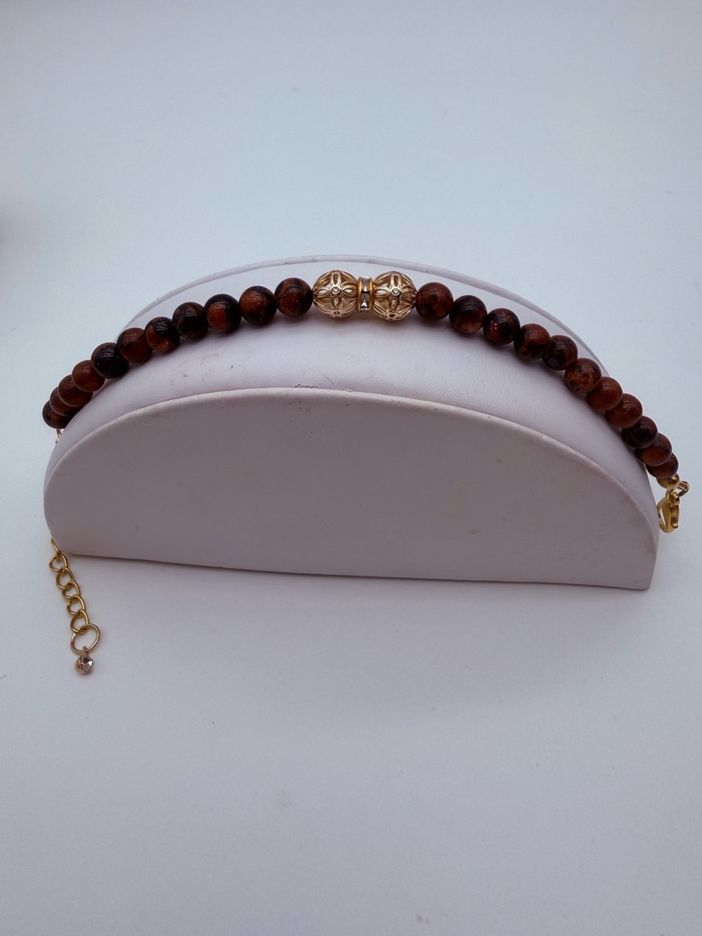 Elegant Sparkling Brown & Black Goldstone Bracelet with Gold Filigree Accents